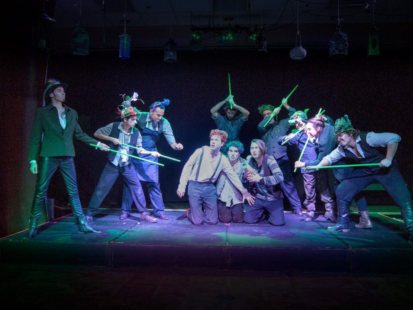 A group of people posing on the stage at the Conrad N. Hilton Theater.