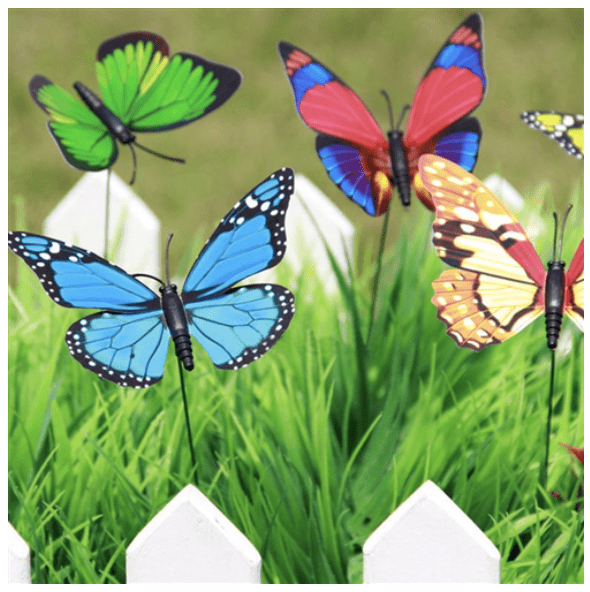 A group of colorful Butterfly Garden on a white picket fence.