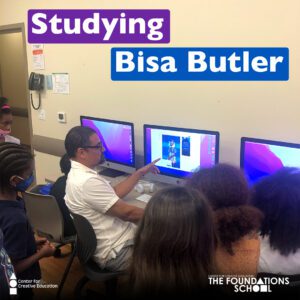 A group of people sitting in front of computers studying Bisa Butler.