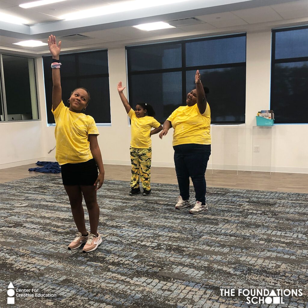 Three Children in Matching Yellow Shirts