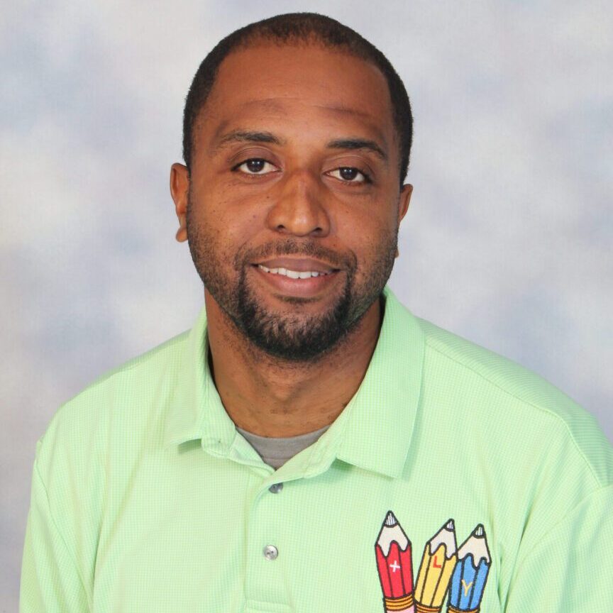 Man in green shirt with pencil logo.