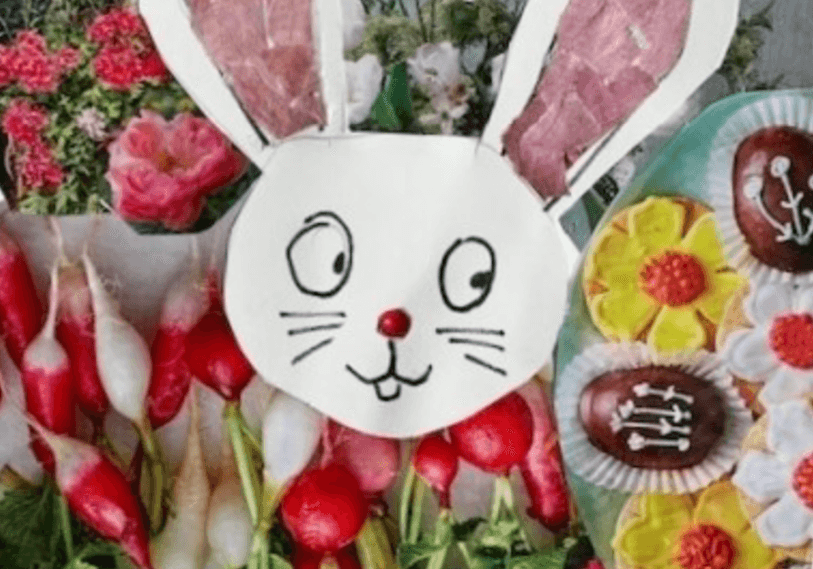 A picture of a bunny with flowers, radishes, and a message from the president.