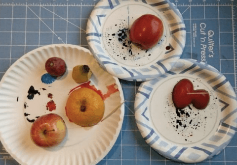 Three plates of fruit painted with virtual creativity.